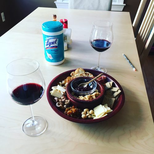 Our new reality: cheese plates, wine and Lysol wipes to keep the house germ free.