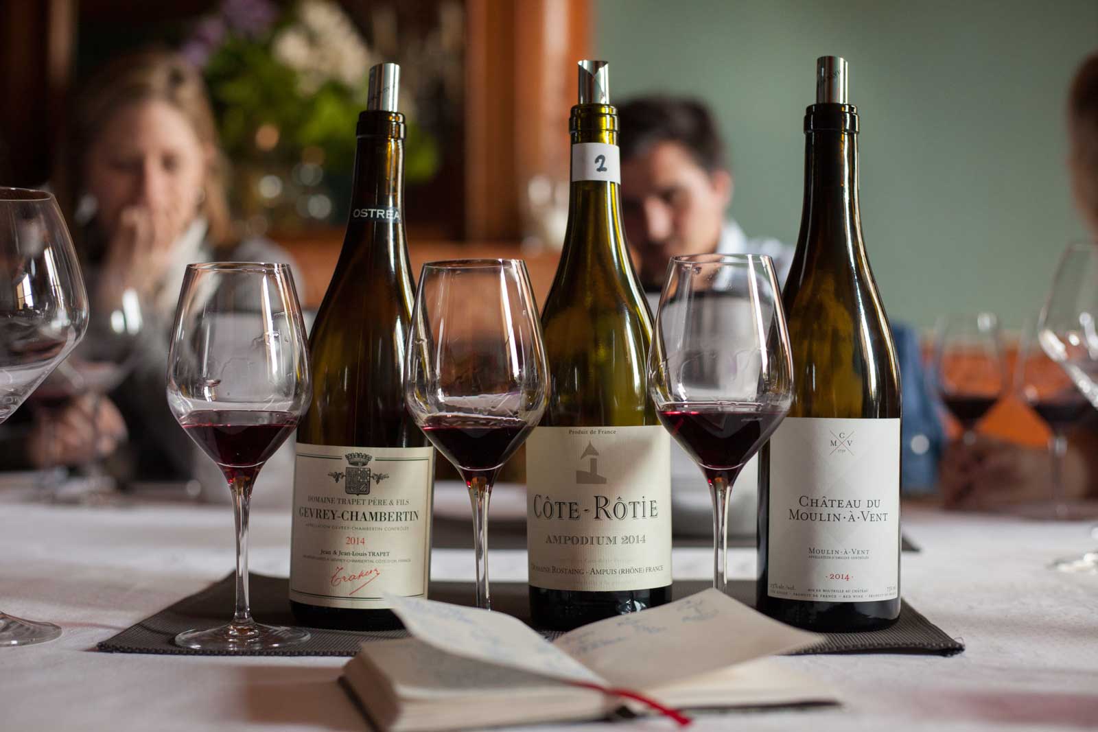 Bottles of Gevrey-Chambertin, Côte-Rôtie and Château du Moulin-à-Vent wine. ©Kevin Day / Opening a Bottle