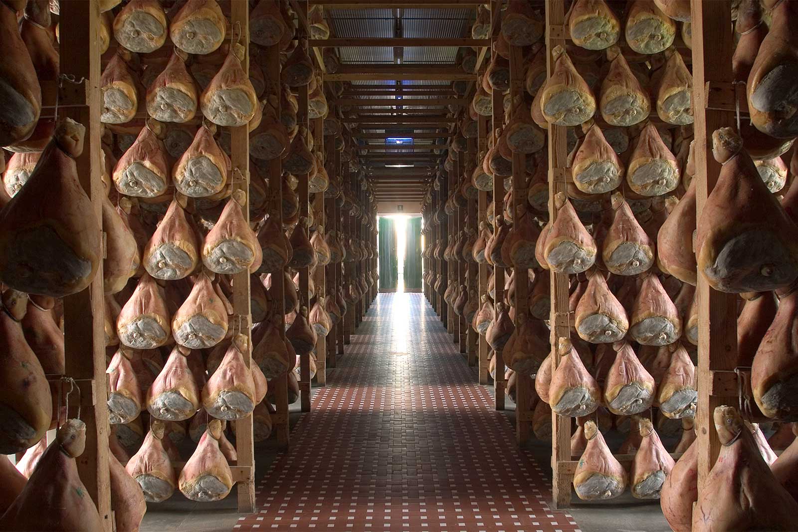 Depending on your perspective, Prosciutto di Parma may be Emilia-Romagna's greatest gift to the world. And Lambrusco is the ideal wine to pair with a slice. ©Consorzio del Prosciutto di Parma