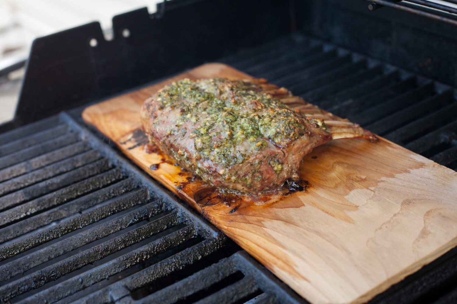 Rack of lamb on wood plank