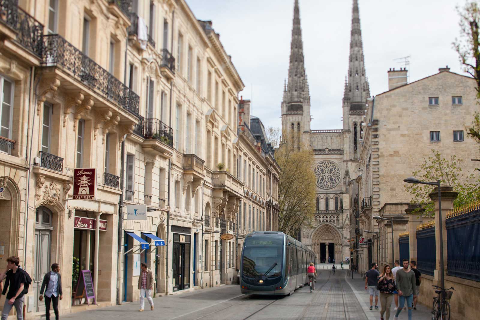 One of the efficient light-rail trains ambles up Rue Vital Carles with Cathédral Saint-André de Bordeaux in the distance. ©Kevin Day / Opening a Bottle