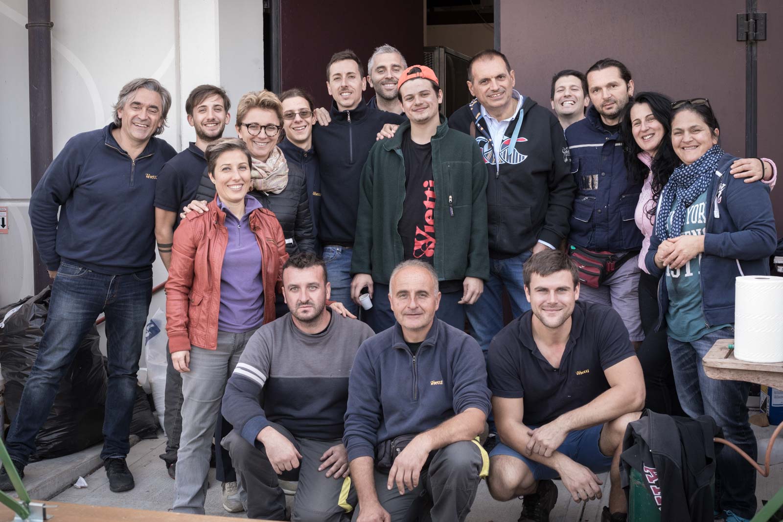 Luca and Elena Currado pose for a team photo at Vietti's Serralunga warehouse. ©Kevin Day/Opening a Bottle