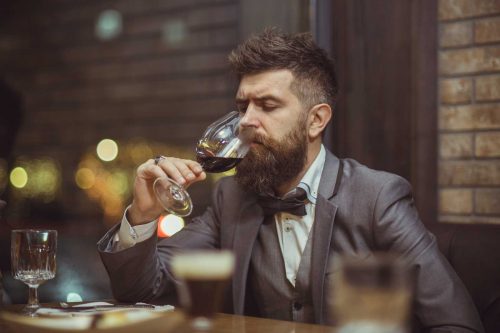 This is what stock photographers think of wine drinkers. Note: I think that is the same hipster model in the featured photo above: "Beer drinking is mirthful! Wine is deathly serious."