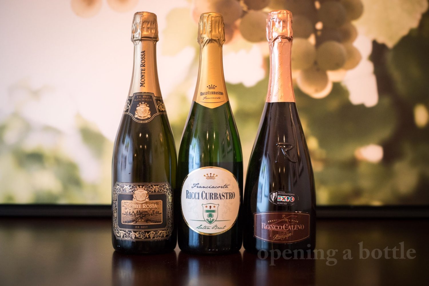 Three wines from Franciacorta: a Blanc de Blanc, Saten and Rosé. ©Kevin Day/Opening a Bottle