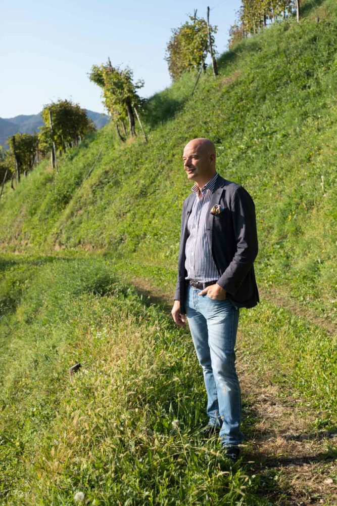 Gianluca Bisol, proprietor of Bisol, stands in the Rive di Campea vineyard near Valdobbiadene. ©Kevin Day/Opening a Bottle