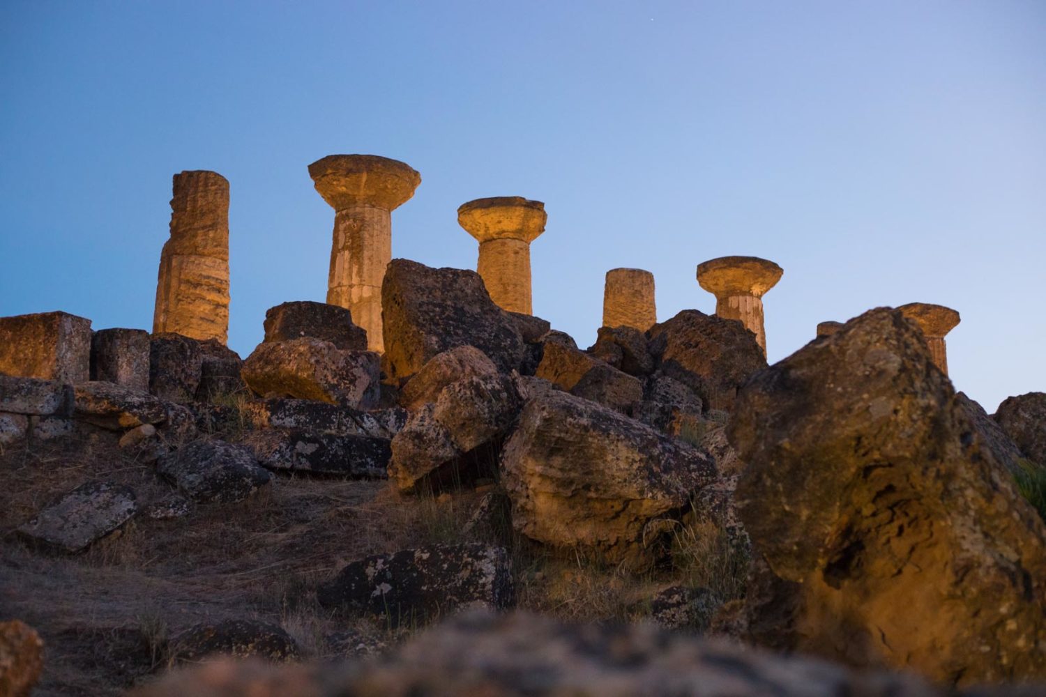 What remains of the Temple of Heracles, peering over the bluff's rubble at sunset. ©Kevin Day/Opening a Bottle