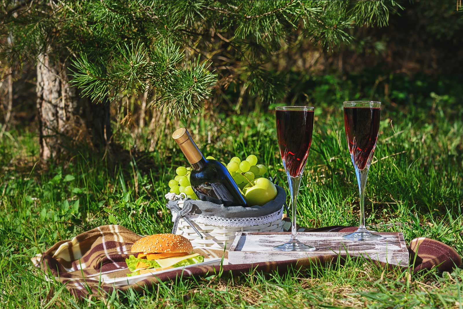 "Two brimful glasses of wine and a burger for one in the grass, please."