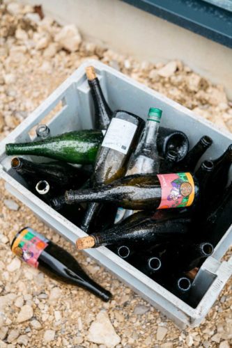 Empty bottles in the rain outside Domaine de l'Octavin./ ©Cecilia Magnusson