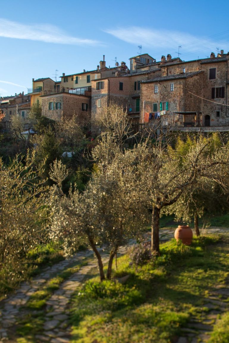 Early morning light illuminates the ancient buildings of Montalcino, Italy. ©Kevin Day/Opening a Bottle