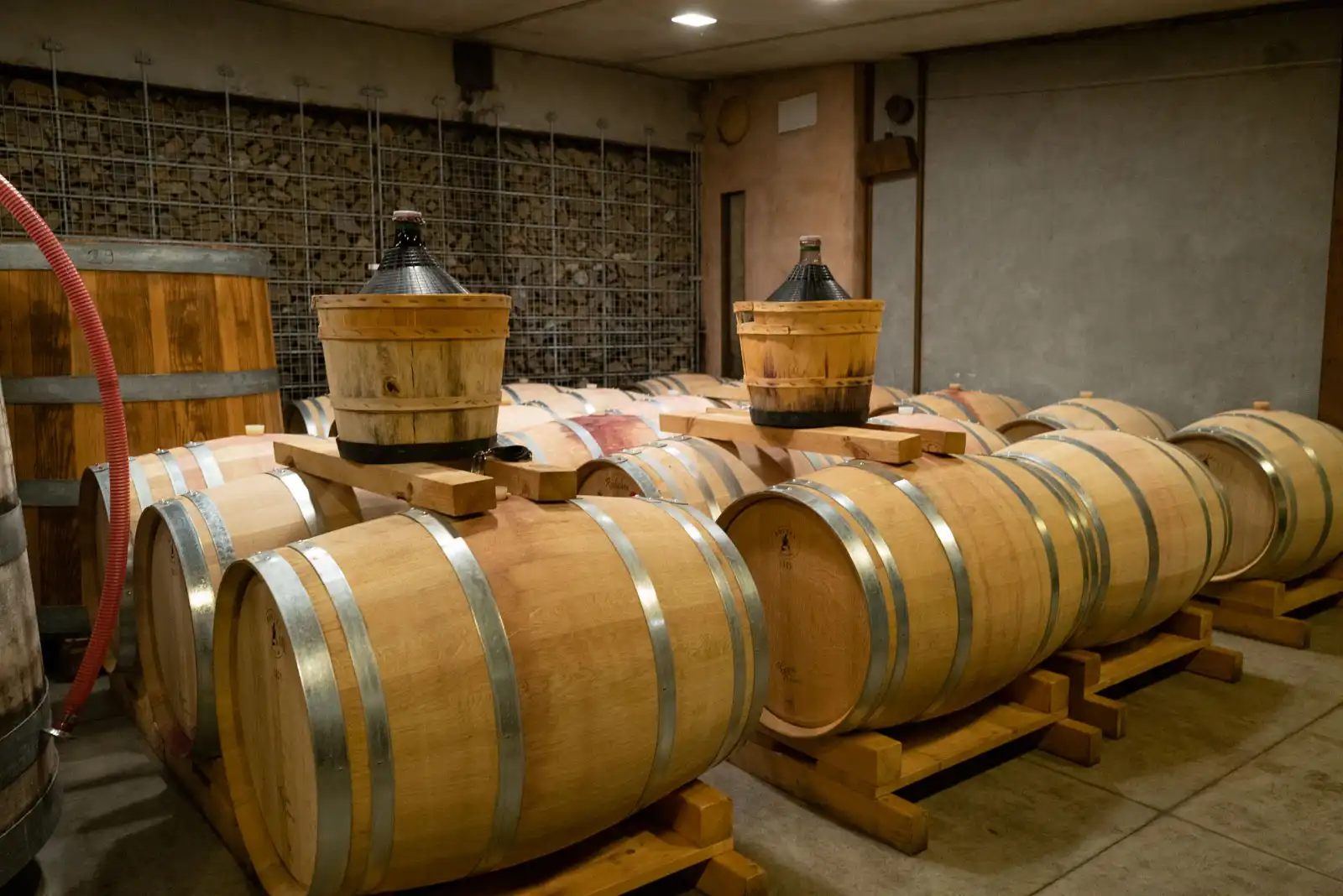 Oak barrels at Borgo del Tiglio in Brazzano, Italy.