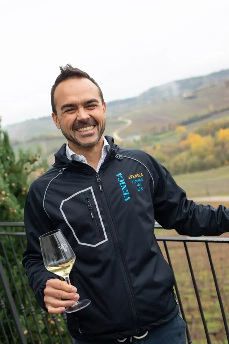 Winemaker Giampaolo Venica smiles with a glass of his Collio Friulano.