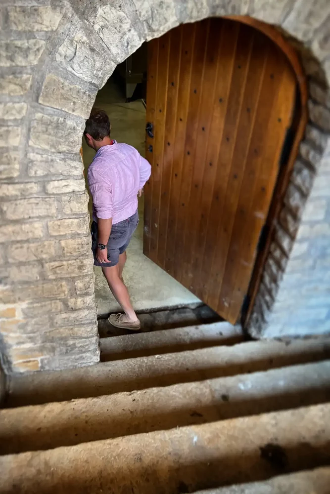 Winemaker Pierre de Benoist walking into his underground cellar at Domaine de Villaine in Bouzeron, France.