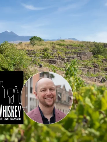 Vineyards of Mount Etna with Food, Wine & Whiskey Podcast logo and head shot of wine expert Kevin Day