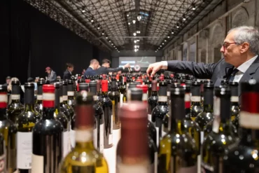 Sommelier service at the Chianti Classico Collection event at Stazione Leopolda in Florence, Italy