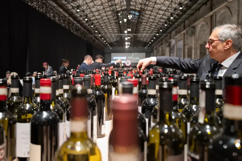 Sommelier service at the Chianti Classico Collection event at Stazione Leopolda in Florence, Italy
