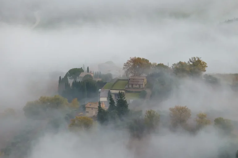 Clouds parting below Montalcino after days of rain