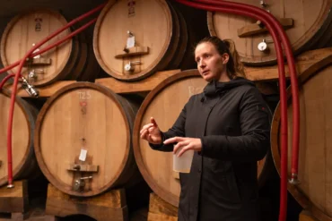 Tamara Podversic talks about her winemaking techniques inside her winery’s cellar.