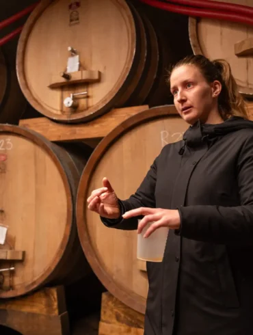 Tamara Podversic talks about her winemaking techniques inside her winery’s cellar.
