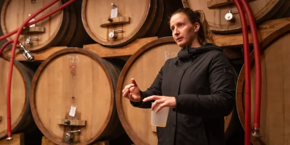 Tamara Podversic talks about her winemaking techniques inside her winery’s cellar.