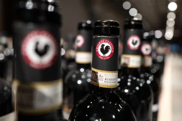 Numerous bottles of Chianti Classico wine with the prominent Black Rooster logo visible