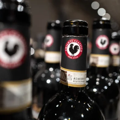 Numerous bottles of Chianti Classico wine with the prominent Black Rooster logo visible