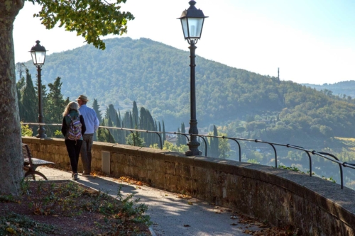 A couple goes for a stroll through Radda in Chianti. ©Angie Day