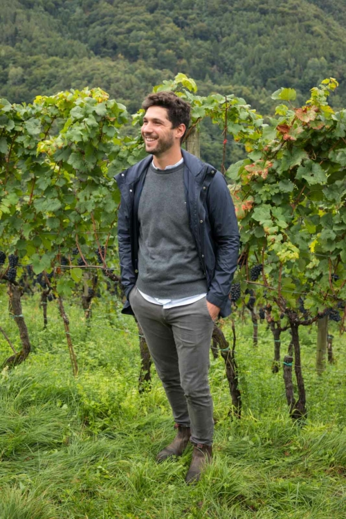 Oenologist Hannes Pfitscher in his family's Gleno vineyard. ©Kevin Day/Opening a Bottle