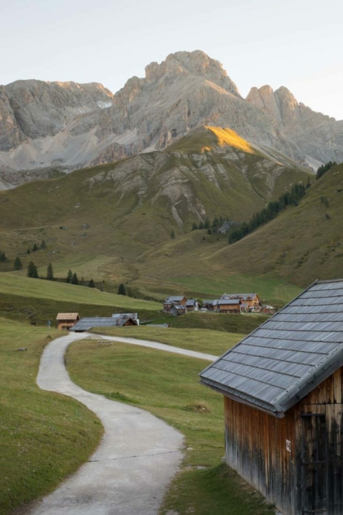 Walking through Rifugio Fuciade during sunrise. ©Kevin Day/Opening a Bottle