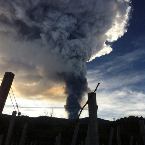 Mount Etna spews ash into the sky in 2018, as seen from one of Passopisciaro's vineyards. Today, the winery faces a very different existential threat: the global economy. ©Passopisciaro Mount Etna spews ash into the sky in 2018, as seen from one of Passopisciaro's vineyards. Today, the winery faces a very different existential threat: the global economy. ©Passopisciaro