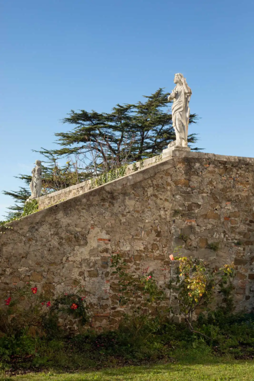 A lone statue crowns a garden wall at Abbazia di Rosazzo in Northern Italy.