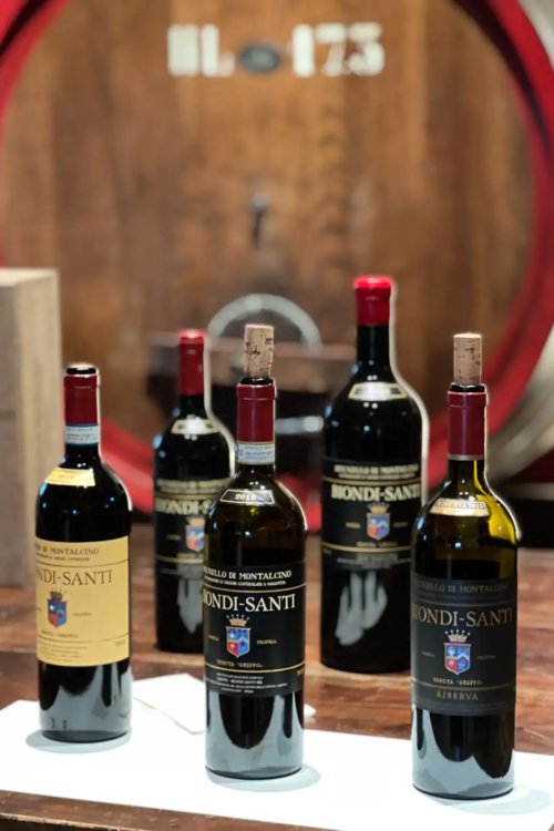 The three Montalcino wines of Biondi-Santi, with two large-format bottles in the background.